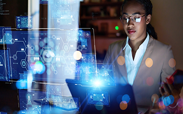 illustration of numbers figures and nodes connected on dark background with person looking at computer screen