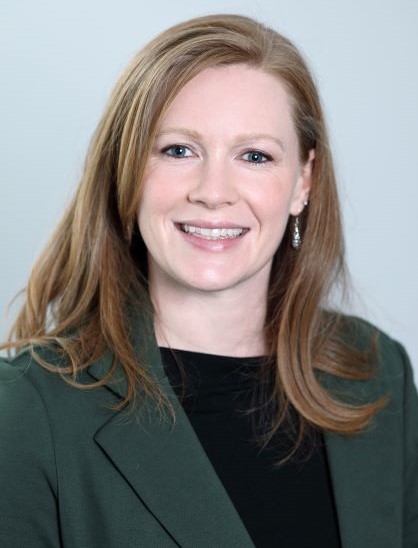 female wearing green blazer